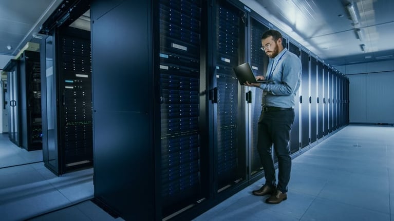 person standing in server room