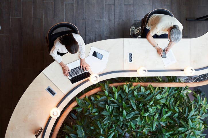 people working on devices at business from a view above